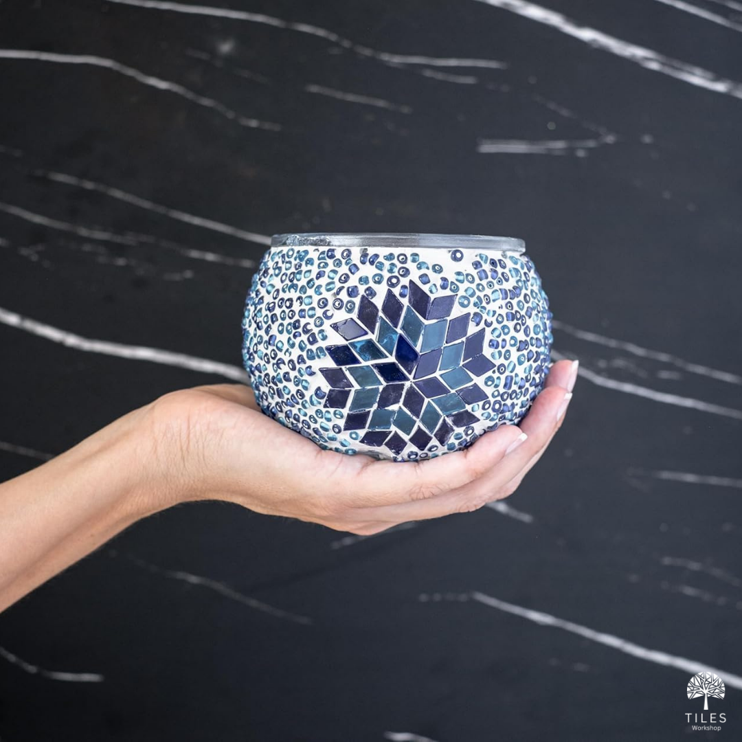 Hand holding blue and white turkish lamp kit candle holder with geometric star pattern for turkish lamps by Tiles Workshop