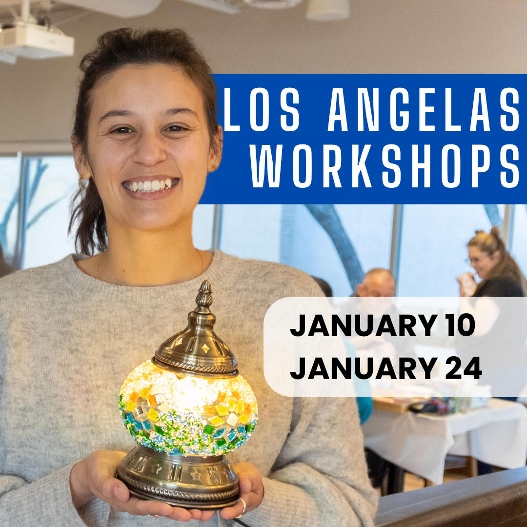 Woman holding yellow and green turkish mosaic lamp with brass base at Turkish Lamp Making Workshop Los Angeles California by Tiles Workshop